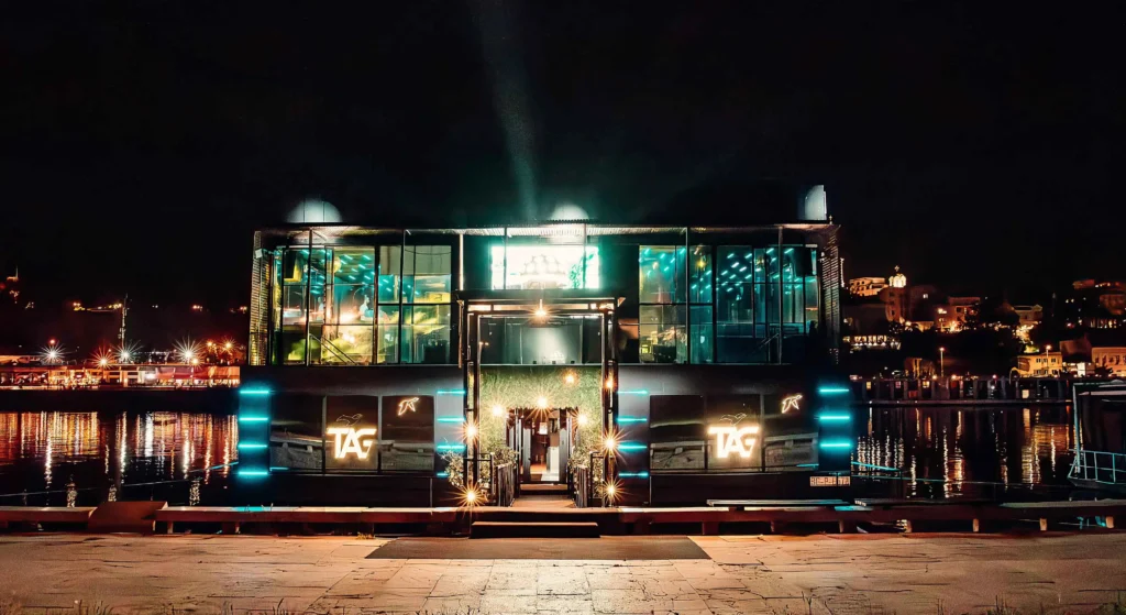 Two-floor interior of Tag nightclub in Belgrade, featuring a lively crowd and modern design.